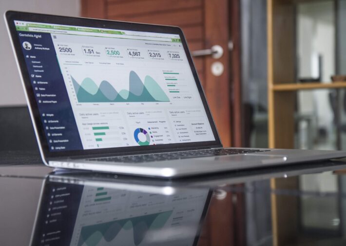 Product manager surrounded by icons representing AI, IoT, Big Data, and Agile methodologies, illustrating the impact of technology trends on product management